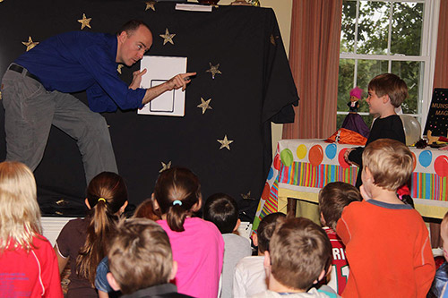 Munsey's Magic performs at a birthday party